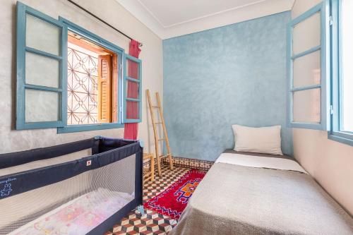 מיטה או מיטות בחדר ב-Exclusive private Riad