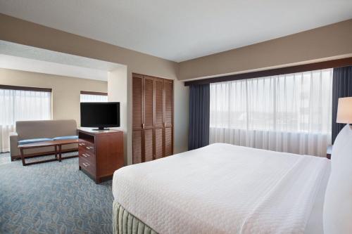 a hotel room with a bed and a television at Crowne Plaza Hotel Los Angeles Harbor by IHG in San Pedro