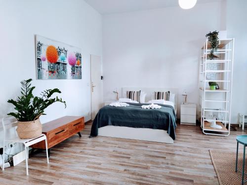 a bedroom with a bed and white walls at Cozy studio in Friedrichshain, 4 quiet guests only in Berlin