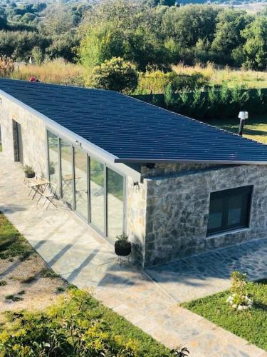 a house with solar panels on top of it at Spitaki in Ioannina