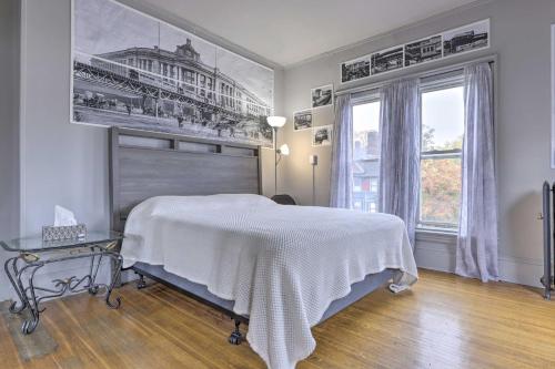 a bedroom with a bed and a large window at Charming Springfield Apt Less Than 2 Mi to Downtown! in Springfield