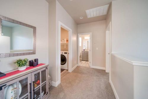 a laundry room with a sink and a mirror at Majestic Zion Cottage with hot tub in Hildale in Hildale