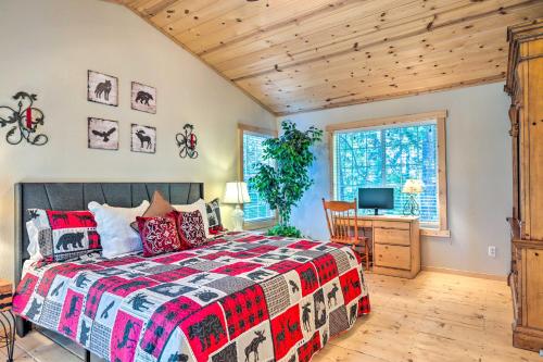 a bedroom with a bed and a desk and a television at Arnold Cabin with EV Charger, Fire Pit and Hikes! in Arnold