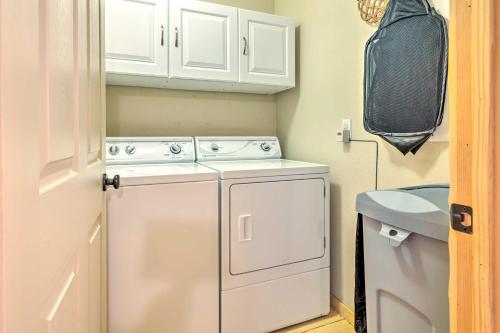a small laundry room with a washer and dryer at Arnold Cabin with EV Charger, Fire Pit and Hikes! in Arnold