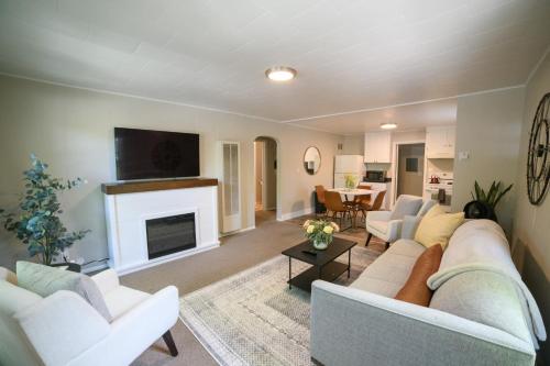 a living room with a couch and a fireplace at Adorable and Cozy Bungalow in Great Falls