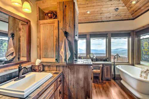 a bathroom with a tub and a sink and a bath tub at Luxury Sapphire Cabin Mtn Views and Resort Access! in Sapphire