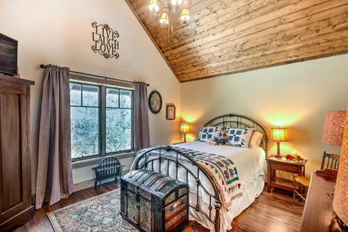 a bedroom with a bed and a wooden ceiling at Luxury Sapphire Cabin Mtn Views and Resort Access! in Sapphire