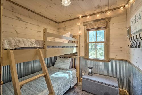 a bedroom with bunk beds in a cabin at Stunning Cabin Getaway with Private Hot Tub! in Rising Fawn