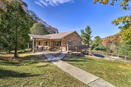 a brick house with a pathway leading to a yard at Welcoming Boone Getaway Near Hiking and Skiing! in Boone