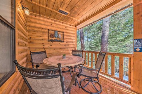 a dining room with a table and chairs in a cabin at Charming Coppertop Cloudcroft Cabin 3 Mi to Ski in Cloudcroft