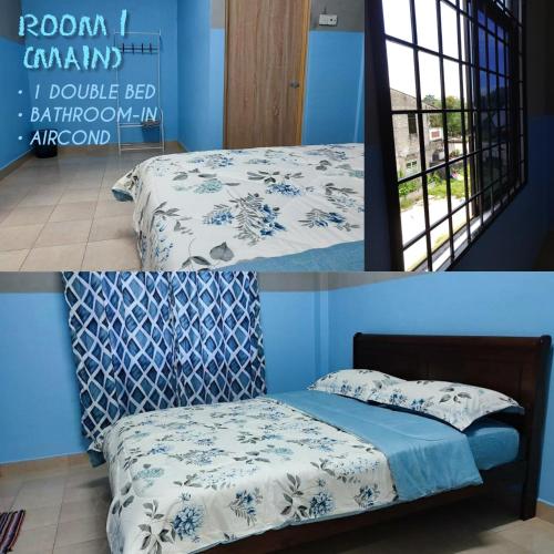 uma cama num quarto com uma parede azul em Ace Inn Guest House em Rantau Panjang