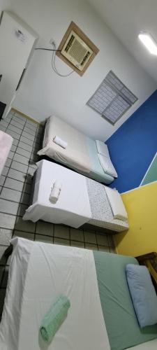 Ένα ή περισσότερα κρεβάτια σε δωμάτιο στο Hotel Beira Mar