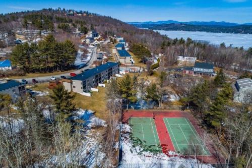 an aerial view of a park with a tennis court at Spacious Condo Walking distance to Weirs in Laconia