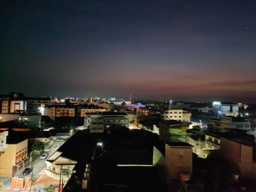 a view of a city at night with lights at The Harbour Front Hotel in Suratthani