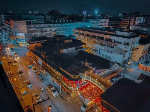 an overhead view of a city at night at The Harbour Front Hotel in Suratthani