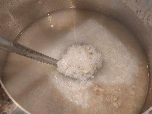 a pot of rice with a spoon in it at The Harbour Front Hotel in Suratthani