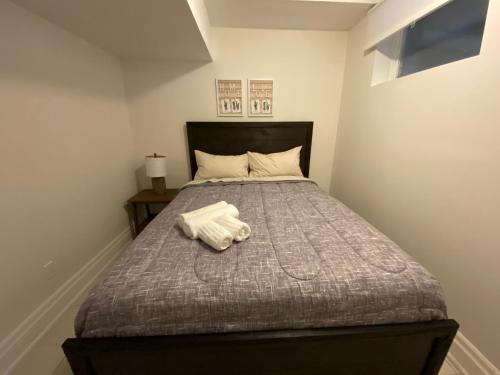 a bedroom with a bed with a towel on it at Yorkmills and Bayview !C Cozy & Stylish Private Bdr with Shared Bathroom in Toronto