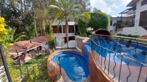 a view of a swimming pool from a balcony at El Castillo de Nallig in Gualaceo