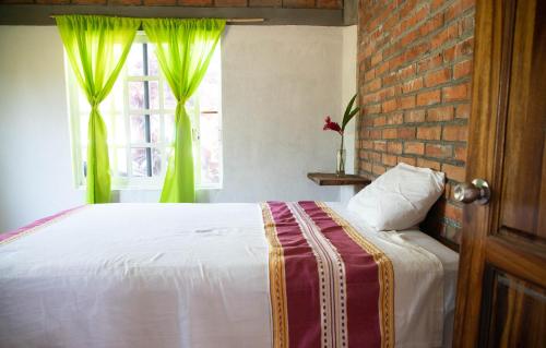 Un pat sau paturi într-o cameră la Casa Conejo
