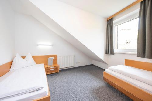 Postel nebo postele na pokoji v ubytování Sunshine Appartements Schilchegger