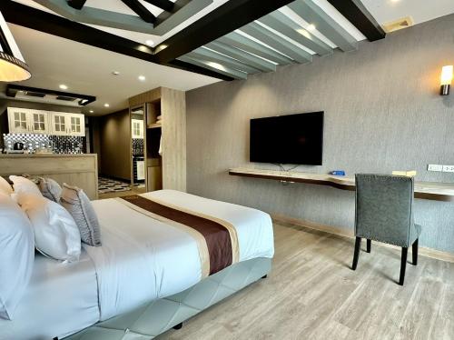 KTK Pattaya Hotel & Residenceにあるテレビまたはエンターテインメントセンター