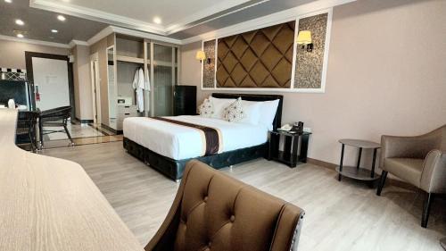 KTK Pattaya Hotel & Residenceにあるテレビまたはエンターテインメントセンター