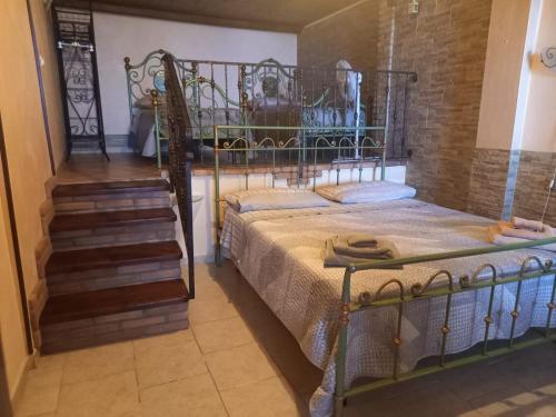 a bedroom with two bunk beds and a staircase at la casa del glicine in Iglesias