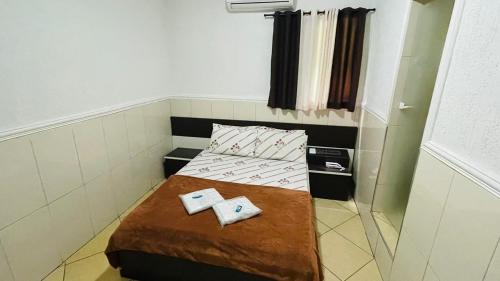 a small room with two beds in it at Hotel Tenda Brigadeiro SP in Sao Paulo