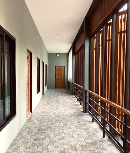 a corridor of a building with a hallway at Look at Home Lamphun in Lamphun
