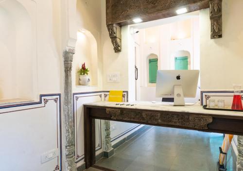 an office with a desk with a computer on it at Bloom Boutique - Chelon Haveli in Jaipur