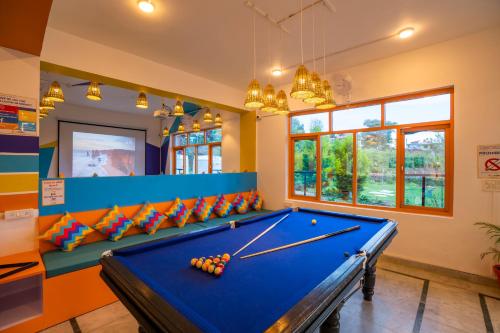 a billiard room with a blue pool table at goSTOPS Bir, Landing Site in Bīr