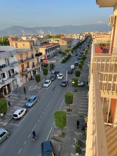 a view of a city street with cars parked at B&b L’Attico e la Ballata in Brusciano
