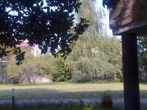 a view of a field of grass with trees at Albergo Villa & Roma in Palazzolo sullʼOglio