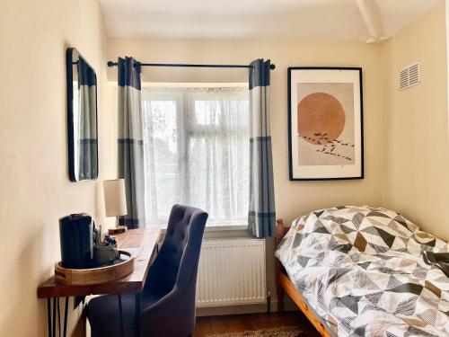 a bedroom with a desk and a bed and a window at Guest House Rooms Birmingham in Birmingham