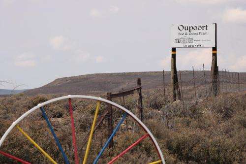 a sign that says outpost next to a fence at Oupoort Eco & Guest Farm - Sutherland - Middelpos in Sutherland