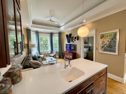 a kitchen with a sink and a living room at 2F Chicago's Little Italy near West Loop & Downtown in Chicago