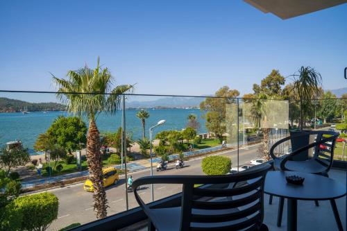 a balcony with a view of the water at Ansira Fethiye in Fethiye