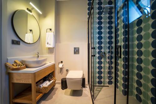 a bathroom with a sink and a shower at Ansira Fethiye in Fethiye