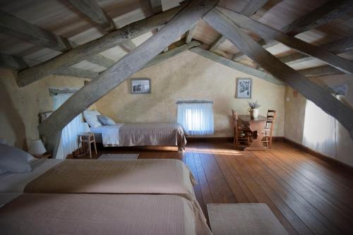 a bedroom with two beds in a attic at At Home In Istria- Villa Stancia Cicada in Žminj