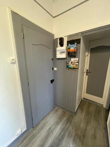 an empty room with a door and a hallway at Les bords du lac in Cany-Barville