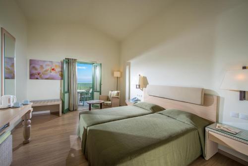 Posteľ alebo postele v izbe v ubytovaní Silva Beach Hotel