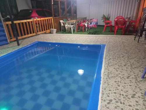 a ping pong ball sitting on a checkered floor at Cabaña Vacacional Donde Ibañez in Fusagasuga