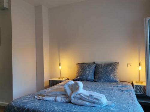 a bedroom with a bed with a towel on it at Studio ruffec 10 in Ruffec