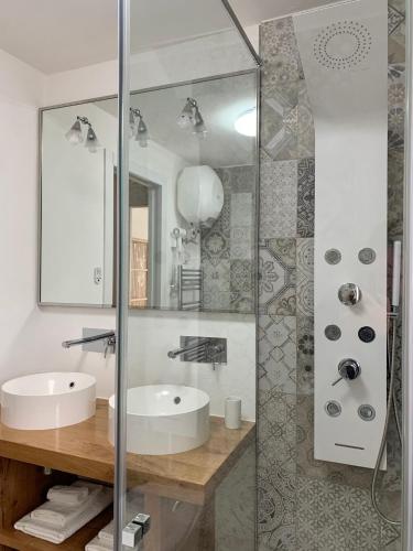 a bathroom with a sink and a mirror at Casa Lorica Marilleva 1400 in Marilleva