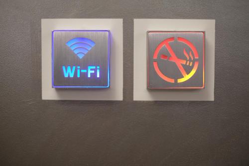three signs on a wall with awwf and a parachute at LeNotti Verona in Verona