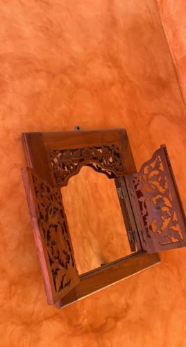 a mirror on the floor in a room at Domaine de la Borde in Damparis