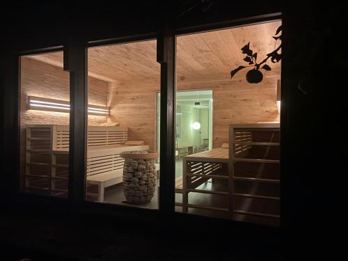 a view of a room with a table through a window at NaturApartments - Hideaway & Spa in Burg