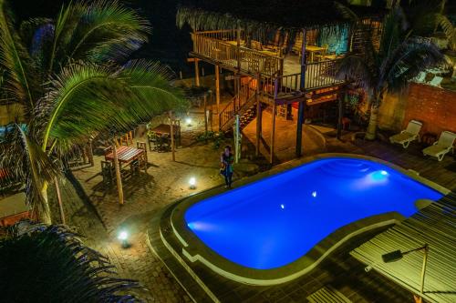 an overhead view of a swimming pool at night at Blue Ocean in Máncora