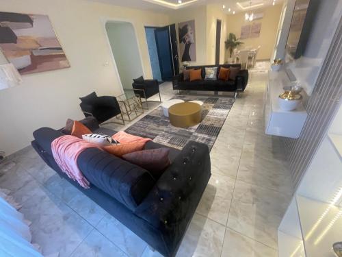 a living room with a couch and a table at Romel Terraces in Lagos