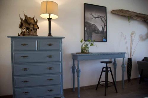 a bedroom with a blue dresser and a blue desk at CABARETE BEACH HOUSES the NANNY ESTATES in Cabarete